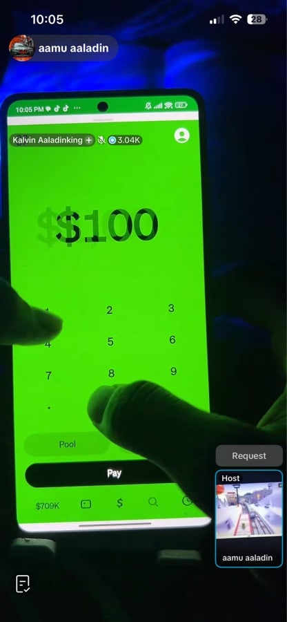 Mobile phone showing Cash App with a green payment screen and $100 amount entry